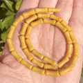 Close-up of 5x12mm yellow bamboo-shaped natural stone beads for DIY jewelry making - One Strand Approx 31 Pieces (5x12mm) / Topaz