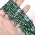 Macro detail of 4mm faceted green malachite stone spacer beads for DIY jewelry making. - 1 Strand Approx 98 Beads (4mm) / Malachite