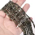 Close-up of 4mm faceted natural stone disc beads for DIY jewelry making on hand - 1 Strand Approx 98 Beads (4mm) / Green Tourmaline