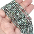 Close-up of 4mm faceted turquoise-colored natural stone disc beads for DIY jewelry making - 1 Strand Approx 98 Beads (4mm) / African Pine Stone