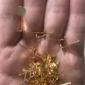 Detailed macro shot of 18k gold-plated earring posts with flat trays for DIY jewelry - 4mm / 18K Gold Plated Brass