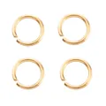 Close-up of four gold-plated copper open jump rings for jewelry making - Jump Rings / 0.6x4mm / 18K Gold