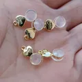 Close-up of heart-shaped 18K gold plated silicone earring backs with 'Love' engraving - Heart With Loop / 1 Piece / Gold