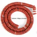 Detailed view of 2x6mm red jasper natural stone spacer beads for DIY jewelry making - Disc Imported Red Stone / 2x6mm / Red Jasper