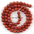 Close-up of 6mm round red jasper natural stone loose beads for DIY jewelry making - Red Stone Round Bead / 6mm / Red Jasper