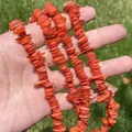 Macro view of vibrant orange fragmented shell beads for handmade DIY jewelry. - Single String / Orange