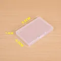Detailed view of a small transparent plastic storage box showing dimensions 9.5x6.3x1.4 cm - Small Square 9.5x6.3x1.4cm