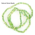 Detailed macro view of 2x4mm faceted light green glass beads for DIY jewelry making - 1 Strand/Pack (2x4mm) / Translucent Green