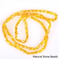 Close-up of amber yellow 2x4mm faceted glass beads for DIY jewelry making - 1 Strand/Pack (2x4mm) / Transparent Light Orange