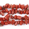 Close-up detail of irregular natural red jasper stone chip beads for DIY jewelry crafts - 39cm Red Stone Chips / 5-8mm / Red Jasper Chips