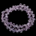 Close-up macro view of 6mm purple faceted strawberry drop crystal beads for DIY jewelry - Approx 88 Beads per Strand / Pink Purple Side-drilled Strawberry Crystal