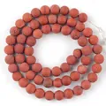 Close-up of 6mm natural red jasper stone beads strand for DIY jewelry making projects - Matte Red Jasper / 6mm / Red Stone (Matte)