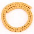 Macro detail of 4x4mm square yellow lava stone beads for DIY jewelry making projects - 85 Pieces/Pack / Yellow