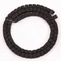 Macro detail shot of 4x4mm square black natural lava stone beads for DIY jewelry making - 85 Pieces/Pack / Black