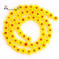 Macro detail of 8mm yellow plum flower glass beads with red centers for DIY jewelry - Approx 52 Pieces per Strand / Yellow