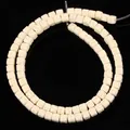 Close-up view of 4x4mm white square volcanic stone beads for DIY jewelry making material - 85 Pieces/Pack / Off White