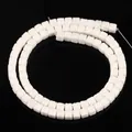 Close-up view of 4x4mm white square porous lava stone beads for DIY jewelry crafting - 85 Pieces/Pack / White