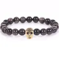 Trendy 8mm black volcanic stone beaded bracelet featuring a gold micro-pave skull charm - 19cm 8mm / Silver Obsidian Gold Skull