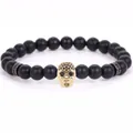 8mm matte black volcanic stone bead bracelet featuring a golden micro-pave skull charm. - 19cm 8mm / Frosted Black Stone Gold Skull