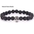 Handmade black lava stone beaded bracelet featuring a micro-pave silver skull charm - 19cm 8mm / Volcanic Stone Silver Skull