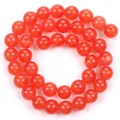 Vista dettagliata di perle tonde occhio di gatto rosse per accessori gioielli DIY - Rosso