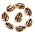 Detailed macro shot of gold-plated natural cowrie shell beads for DIY jewelry making - 10-20mm Random (1 Piece) / KC Gold Shell