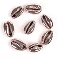 Close-up detail of rose gold electroplated cowrie shell beads for DIY jewelry making - 10-20mm Random (1 Piece) / Light Rose Gold Shell