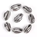 Close-up of metallic silver electroplated cowrie shell beads for DIY jewelry making - 10-20mm Random (1 Piece) / Silver Shell