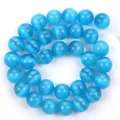 Perline tonde in occhio di gatto sintetico blu brillante per la creazione di gioielli - Blu Lago Occhio di Gatto