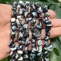 High-detail macro shot of 9-14mm multi-color irregular shell beads for DIY jewelry making - Irregular Black Shell / 9-14mm (Approx 35 Pieces) / Black