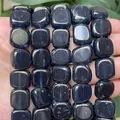 Macro close-up showing the smooth texture of 14x14mm dark blue tourmaline chalcedony beads - 14x14mm / Ink Blue Tourmaline Chalcedony (s3710)