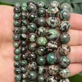 Macro view of polished green snowflake turquoise stone beads for DIY jewelry making - 6mm Approx 58 Pieces / Green Snowflake Turquoise