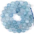 Natural light blue aquamarine round beads for DIY jewelry making in spiral layout - 6mm / Transparent Aquamarine Look