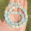 Macro view of light blue natural Amazonite square beads with unique stone textures. - Irregular Shape / Rectangular Slab Amazonite 8x12mm
