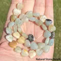 Macro detail of natural heart-shaped Amazonite stone beads for jewelry making - Irregular Shape / Heart Amazonite 10mm