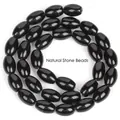 Close-up view of polished black dragon vein agate rice beads for DIY jewelry making projects - 8x12mm Oval Rice Beads / 31 Pieces/Strand / Black Agate Rice Beads