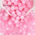 Perline rotonde in resina occhio di gatto rosa con fori diritti per gioielli e bracciali - Occhio di Gatto Rosa