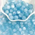 Perline in resina occhio di gatto azzurro con glitter fini per gioielli fai da te - Blu Lago Occhio di Gatto