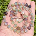Close-up view of natural faceted rainbow fluorite beads for DIY jewelry bracelet making - Faceted Abacus Beads