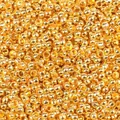 Macro detail of gold-plated copper crimp beads for DIY jewelry making and bead securing. - 2.0mm (500 Pieces/Pack) / Imitation Gold