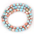 Close-up of irregular lake blue and orange magnesite square beads for DIY jewelry - 5-7mm (Approx 56 Pieces) / Lake Blue and Orange