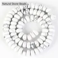 Gros plan de perles rondelles en howlite blanche avec texture marbrée pour bijoux faits - Style Perle Abaque / 5x8mm