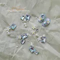 Lente zomer nail art decoratie kit met blauwe strass steentjes madeliefjes en parels - Blauw Madeliefje Materiaal Kit