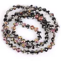 Close-up detail of 6mm faceted four-leaf clover shaped crystal glass beads for DIY jewelry - Four-Leaf Flower Shape / One Strand (6mm) / Black Multicolor