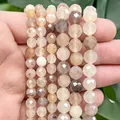 Macro view of faceted natural sunstone and agate beads for DIY jewelry making - Violet Chalcedony