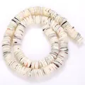 Detail showing natural trochus shell heishi spacer beads with unique green and pink textures - 10-11mm Pack (Approx 200 Pieces) / Beige