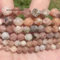 Detailed macro view of faceted peach natural stone beads for DIY jewelry craft - 6mm Approx 58 Pieces / Faceted Plum Blossom Tourmaline