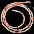 Detailed macro view of 4x2mm cylindrical natural stone beads with orange marble patterns. - Red Network Stone / 80-82 Pieces/Pack