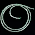 Macro view of 4x2mm cylindrical green natural stone beads for DIY jewelry making - Green Aventurine / 80-82 Pieces/Pack