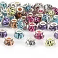Detailed view of assorted multi-colored glass beads with abstract wing patterns for DIY jewelry - Vertical Stripe Flower (#19) / 10 Pieces (14mm)